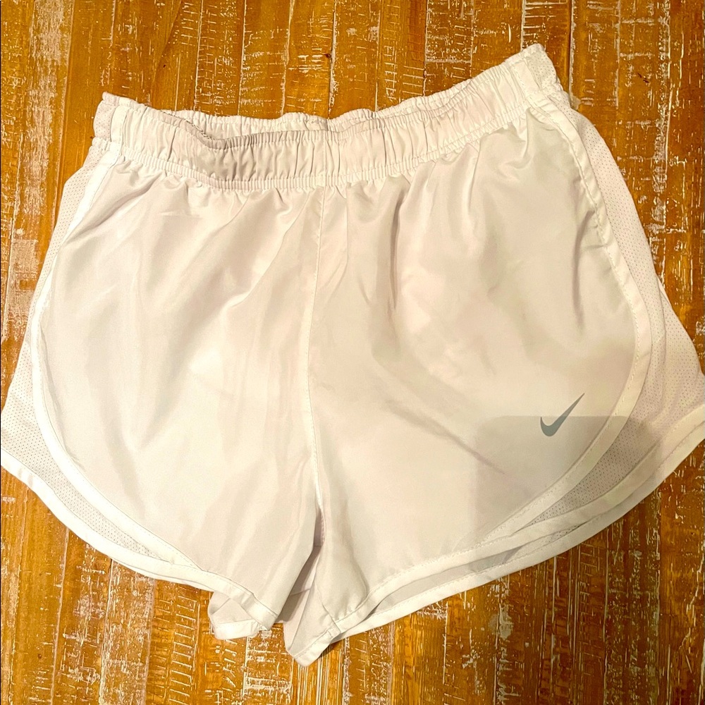 White Nike running shorts